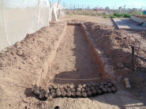 A 1x1x0.1m trench dug to prevent the tree sacks from tipping over. This entire trench will be filled with sacks.