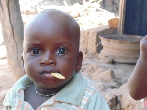 Baby Cherkh Diouf eating a fry. Don't bother me, I'm eating.