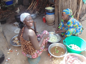 My host mother, Ya Fatou Saar, and sister, Mamjaara Ndiaye, hard at work in the kitchen. Tabaski staples are macaroni, potatoes, and onions. 